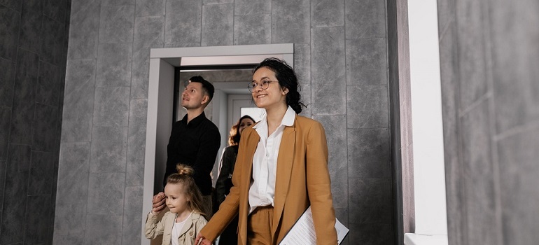 a family entering a new home